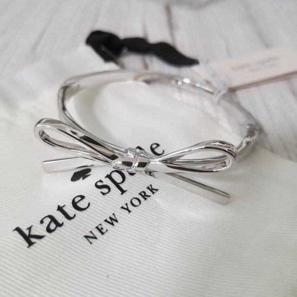 NWT Kate Spade Skinny Mini Bow Bangle in Silver w Pouch O0RU2912 $78 - Picture 1 of 5